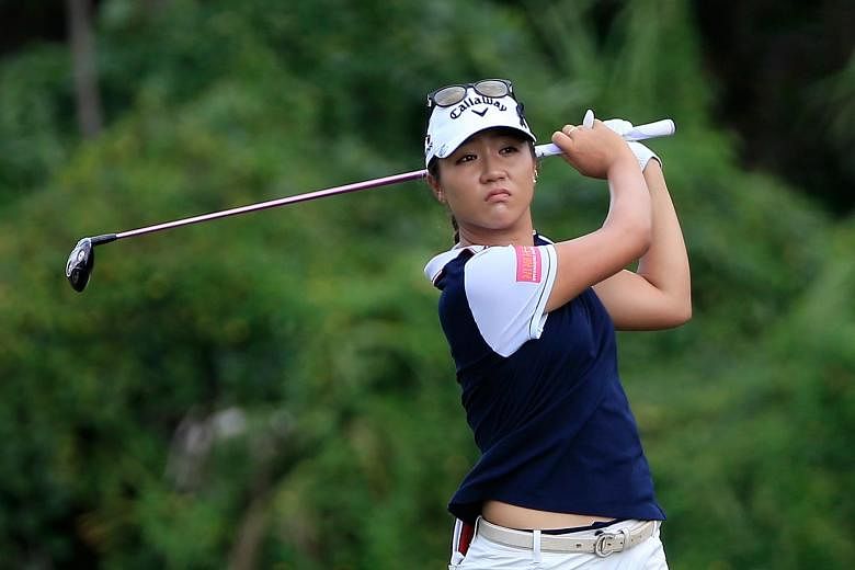 Kiwi teen Lydia Ko driving the ball on the sixth hole, where she had the first of four birdies. South Korean Park In Bee is chasing her down for the year-end top ranking.