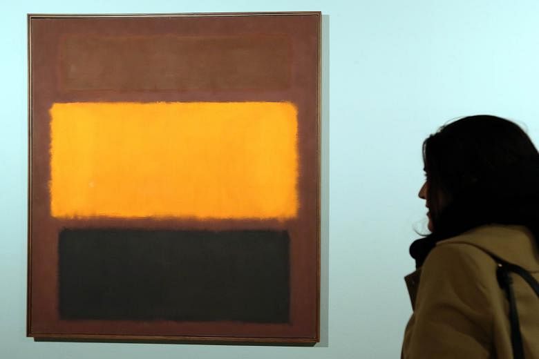 On display at the exhibition are Mark Rothko's Sienna Orange And Black On Dark Brown (left) and Francis Bacon's Reclining Man With Sculpture (above).