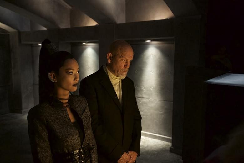 John Malkovich and Chang Shuya (both left) in a clip of the film. It is a project for Remy Martin's Louis XIII cognac, which takes 100 years to make.