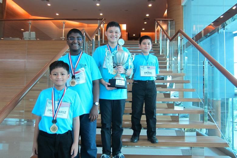 The winning team of the RHB Spelling Masters: (From left) Iman Hariz Mohd Shahrizal, 10; Navin Sivakumar, 12; Ryan Andrew A Salao, 13; and Wan Amirul Aqil Wan Alias, 11.