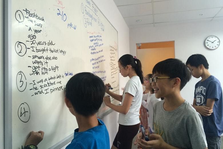 Upper-primary pupils planning their essays at the Study Room. This year, some students made trips to tuition centre co-founder Lim Wei Yi's alma mater, Hwa Chong Institution - aimed at motivating them to study hard - and to a radio station to see how