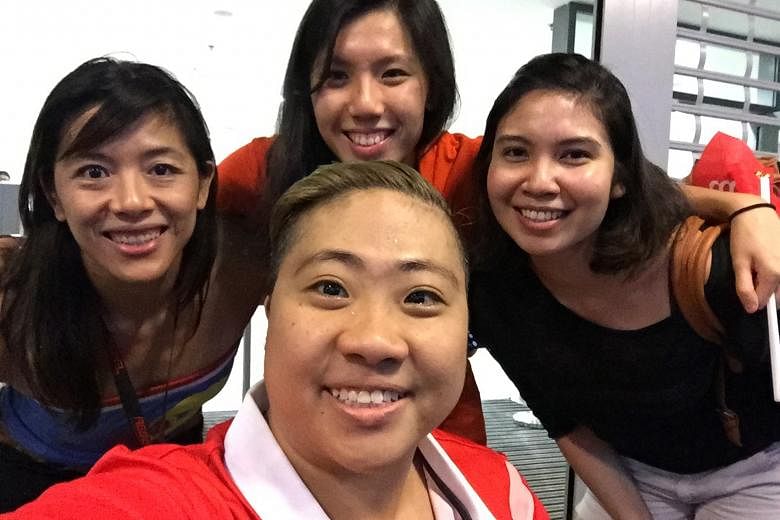 From left: Former swimmer and now MMA fighter May Ooi, swimmer Amanda Lim and bowler Jasmine Yeong-Nathan posing with Theresa Goh (front) for a photo.