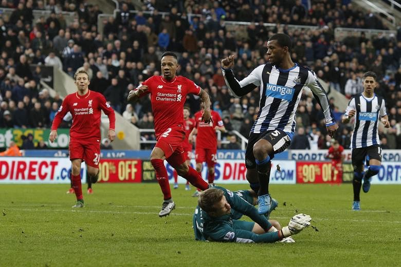 Georginio Wijnaldum (right) scores the second goal in Newcastle United's 2-0 win against Liverpool at St James' Park on Sunday. Liverpool's Juergen Klopp said of his team: "We weren't good enough today."