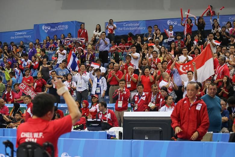 Table tennis singles Class 2 silver medallist Jason Chee saluting the near full house at OCBC Arena Hall 1, which gave him a standing ovation for his dogged fight in the 2-3 loss to Thailand's Natthawut Thinathet in their final round-robin clash. For