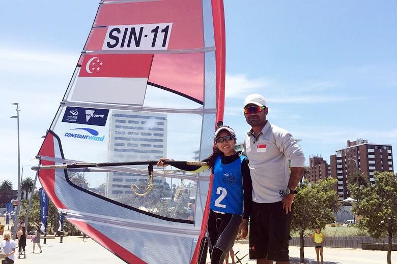 Above: Audrey Yong, who finished second in the women's windsurfing RS:X competition, flanked by her coach Sakda Sakulfaeng at the Sailing World Cup in Melbourne. Yong, who wants to strengthen her technique in strong winds, said: "I chose this race be