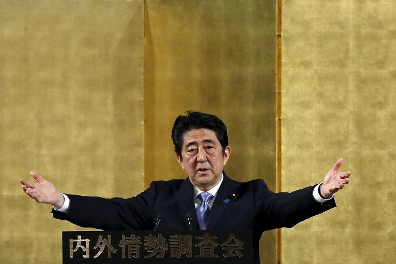 Japanese Prime Minister Shinzo Abe speaking at a lecture event in Tokyo yesterday. Victory in potential double elections next summer would mean Mr Abe need not face voters again until 2019, opening the door for him to push ahead with his long-cherish