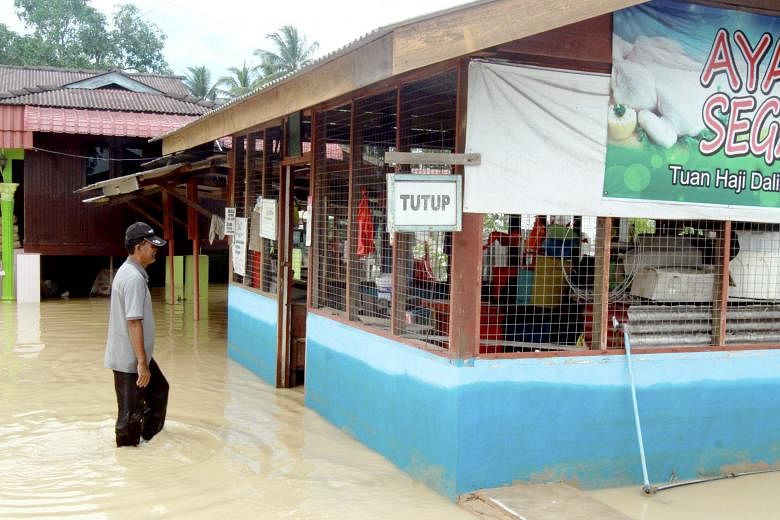 Flooding in Kampung Pengkalan, in Alor Gajah, Malacca, has caused shops to close and forced residents to evacuate to relief centres. Flooding occurred after heavy rain on Sunday, affecting the states of Johor, Malacca, Negeri Sembilan and Selangor.