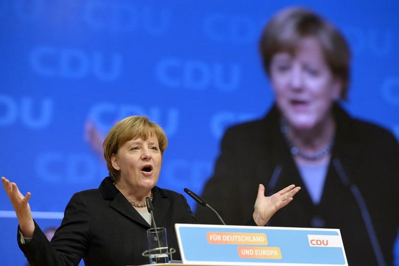 German Chancellor Angela Merkel speaking at the Christian Democratic Union party congress in Karlsruhe, Germany, yesterday.