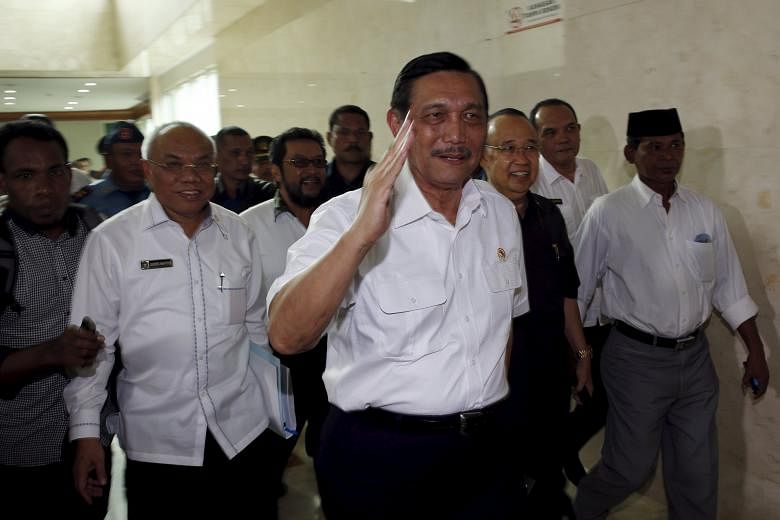 Indonesia's Coordinating Minister for Political, Legal and Security Affairs Luhut Pandjaitan arriving for a parliamentary ethics panel hearing in Jakarta yesterday into the ongoing Setya Novanto-Freeport-McMoRan scandal.