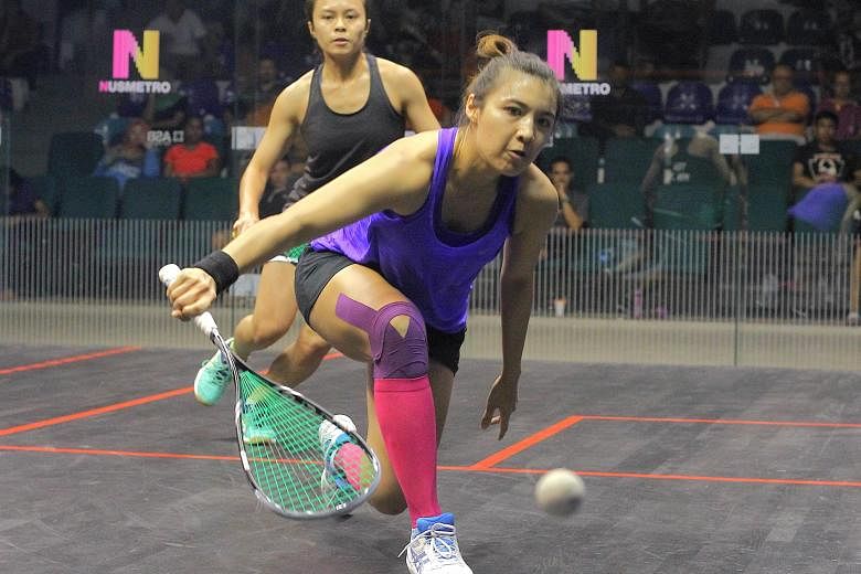 Delia Arnold (right) returning the ball to her opponent Teh Min Jie during their semi-final of the national squash championships in Kuala Lumpur last month. Arnold is the top seed in the women's premier division at the Old Chang Kee Singapore Open, w