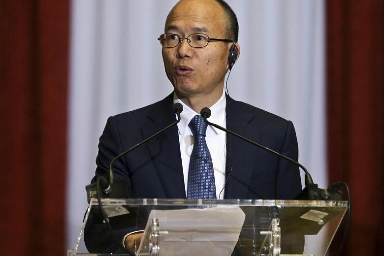 Mr Guo delivering a speech at the Finance Ministry in Lisbon, Portugal, last February. The billionaire and professed taiji devotee subscribes to a mixture of Buddhism, Taoism, Confucianism and "Buffettism".