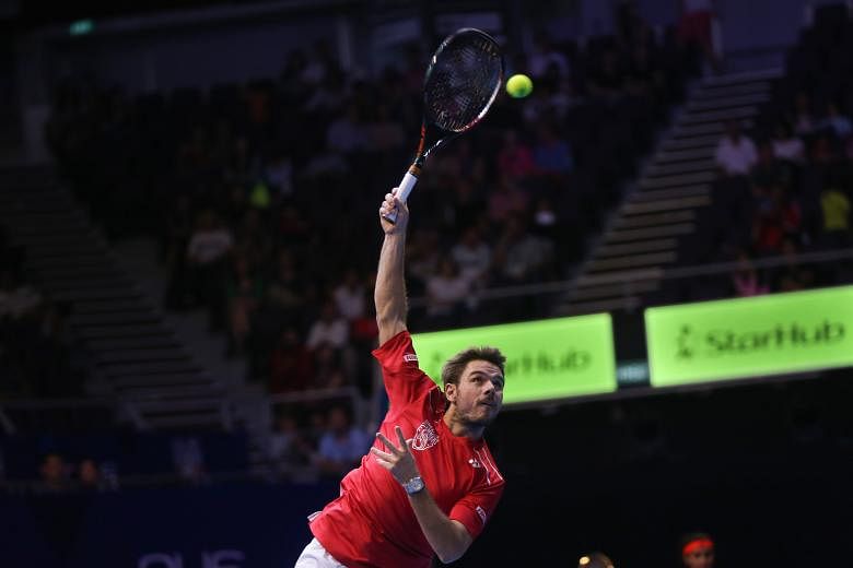 Stan Wawrinka (above) showed his pedigree when he won his singles and doubles matches yesterday to help the Singapore Slammers (left) win this year's IPTL and give home fans plenty to shout about.