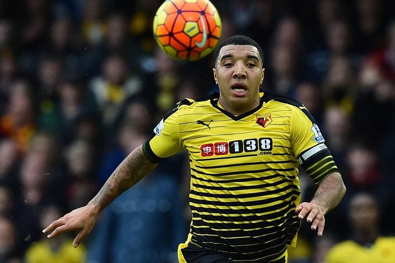 Troy Deeney chasing the ball during the match between Watford and Liverpool. The Hornets defeated the Reds 3-0.