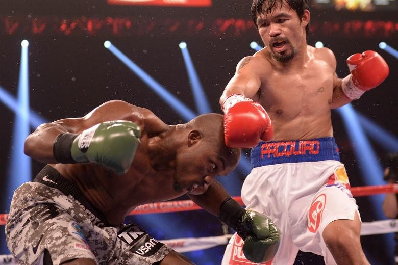 Filipino Manny Pacquiao in action against American Timothy Bradley during their WBO World Welterweight Championship title match at the MGM Grand Arena in Las Vegas in 2014.