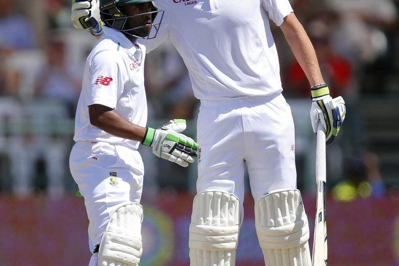 The 1.95m Chris Morris giving Temba Bavuma a pat after reaching 50 runs in the second Test.