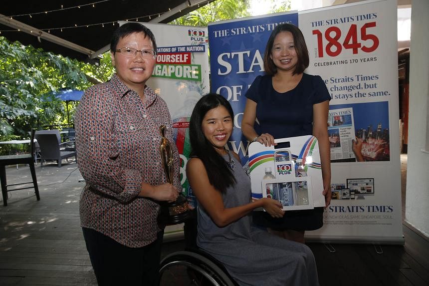 Yip Pin Xiu receiving the ST Star of the Month award for December from deputy sports editor Lee Yulin (left) and F&N Foods marketing manager Celine Tan.