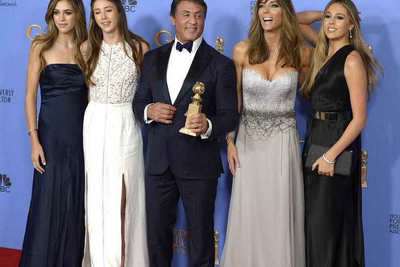 Sylvester Stallone (centre), his wife, Jennifer Flavin (second from right), and their daughters.