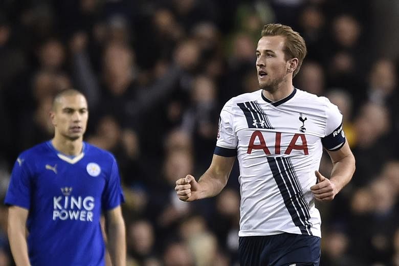 Spurs' Harry Kane (right) celebrating after scoring a last-minute penalty against Leicester to keep his team in the FA Cup.