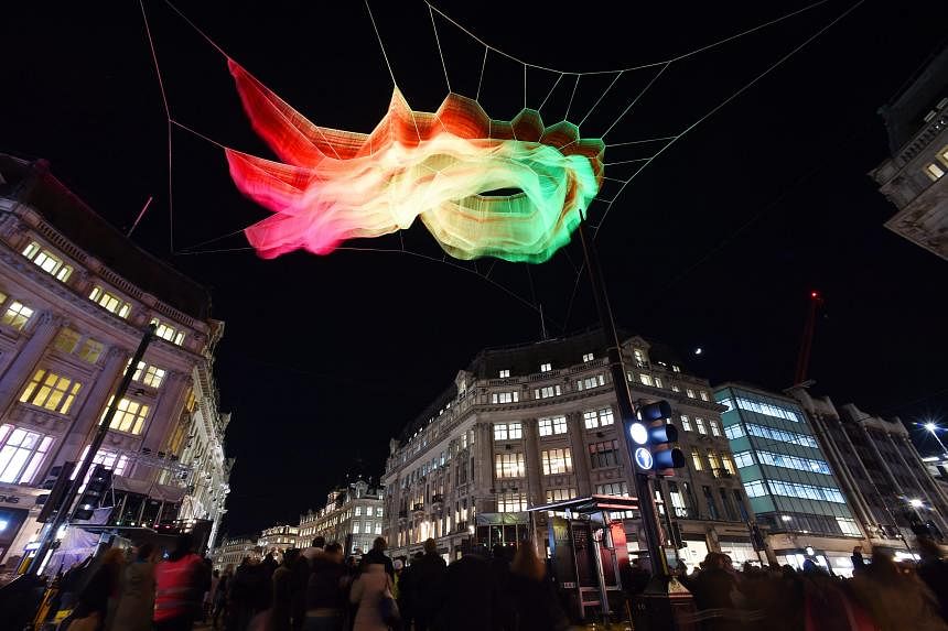 Visitors can walk around the Garden Of Light (above) by French art collective Tilt in Leicester Square. IFO (above) by French artist Jacques Rival. Litre Of Light by British artist Mick Stephenson. American artist Janet Echelman's 1.8 installation ho