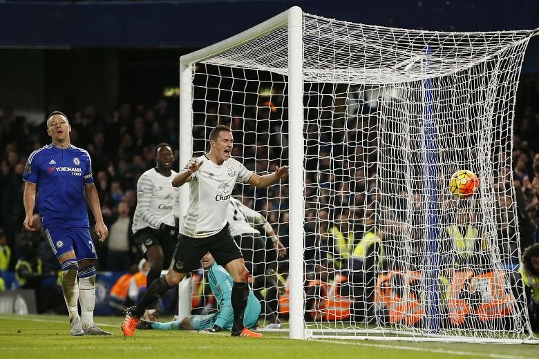 John Terry (left, in blue) in despair after Funes Mori's goal at the start of stoppage time put Everton 3-2 ahead, and (right) celebrating his equaliser, which came in the eighth minute of injury time and from an offside position.