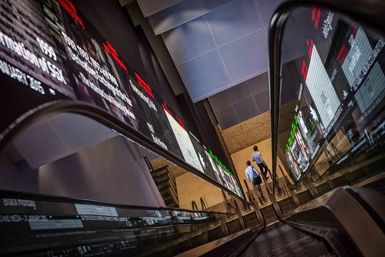 The Singapore Exchange. In a slumping market, some investors are waiting to get blue-chip stocks at rock-bottom prices while others have lost faith in the market and are not looking to invest. Many are also waiting for the Straits Times Index to fall