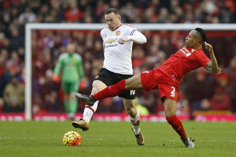 A close-range volley by Manchester United skipper Wayne Rooney (left) in the 78th minute was enough to beat Liverpool, even though they were second-best for much of the clash .