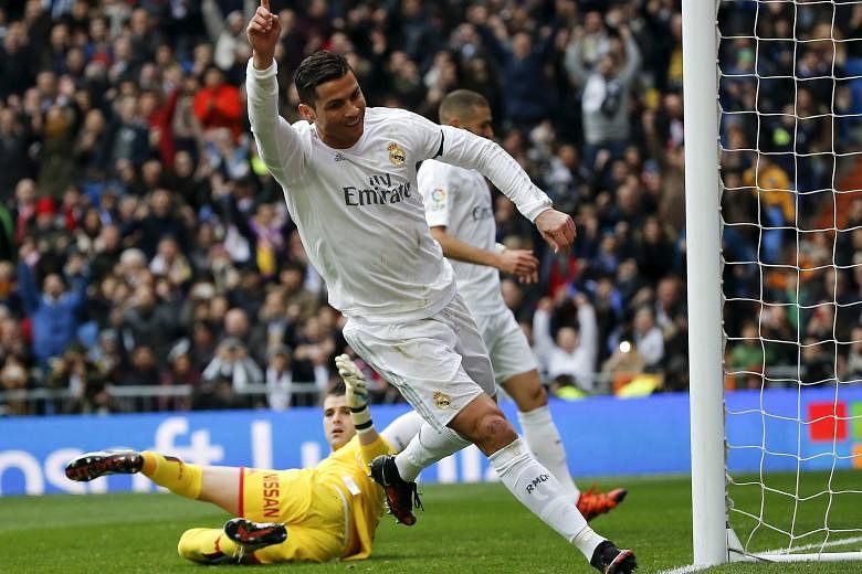 Cristiano Ronaldo celebrating his second goal against Sporting Gijon. Zidane's second match in charge ended 5-1 in favour of Real Madrid.