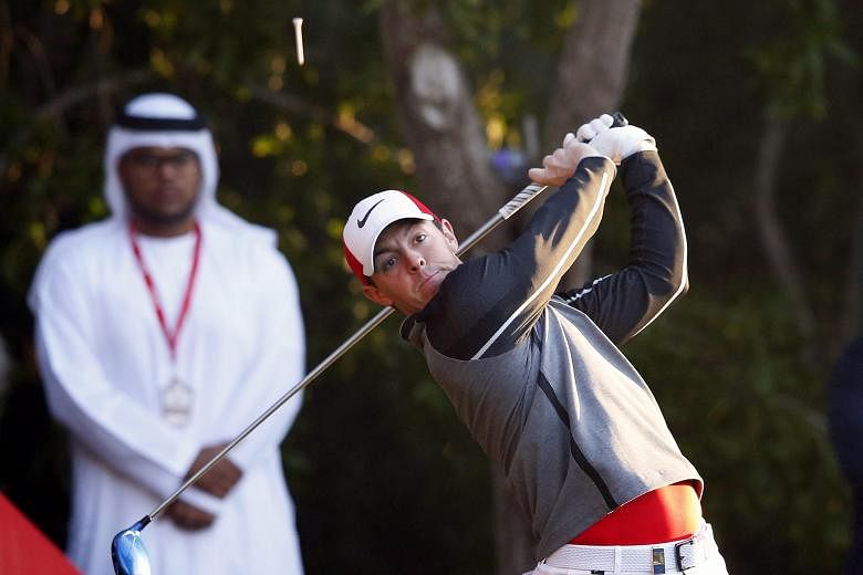World No. 3 Rory McIlroy teeing off during the first round of the Abu Dhabi HSBC Golf Championship yesterday. The Northern Irishman, returning from an extended break, shot a six-under 66 for joint-third spot and is two strokes clear of world No. 1 Jo