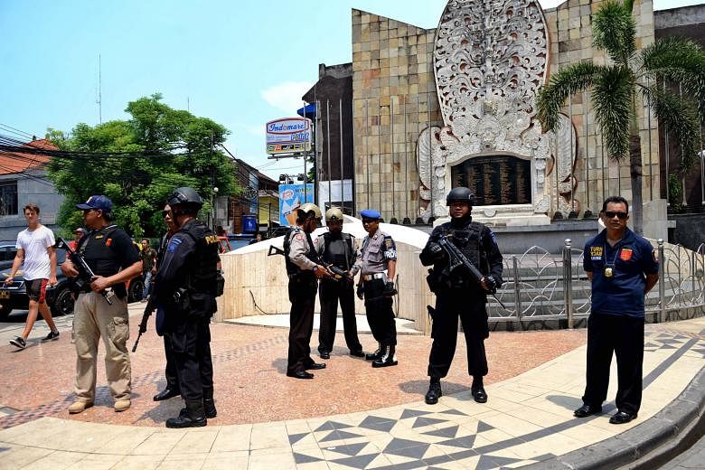 Indonesian police guarding a monument dedicated to those killed in the 2002 Bali bombings in the tourist district of Kuta. A new law is being proposed in the wake of the siege in Jakarta on Jan 14 this year.