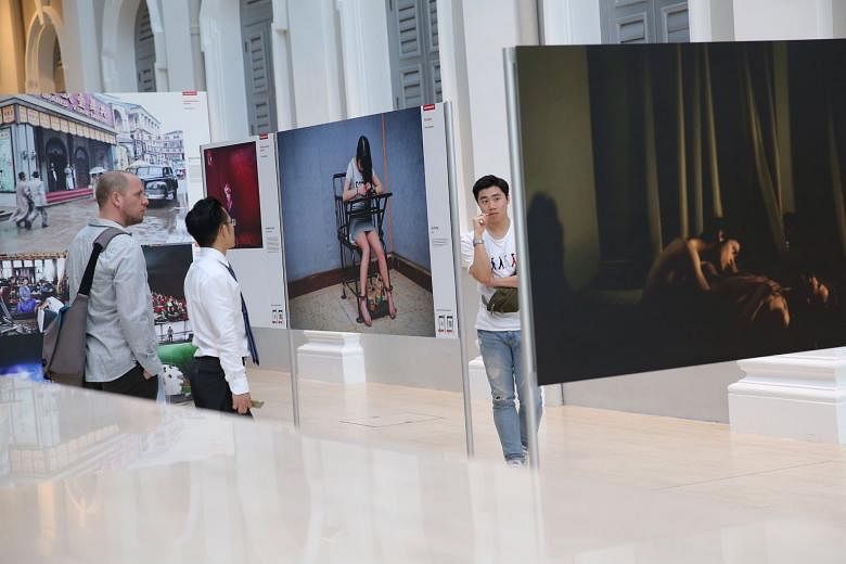 The exhibition held at the National Museum of Singapore showcases 13 of ST's best pieces of photojournalistic work from last year, as well as 145 winning images from the prestigious World Press Photo 2015 contest.