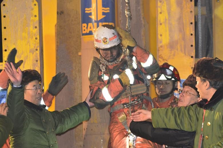 One of the four workers, who had been trapped underground for 36 days, being lifted from a collapsed gypsum mine in Pingyi, Shandong province, last Friday. The four were among 29 trapped when the mine collapsed on Dec 25. Thirteen miners are still mi