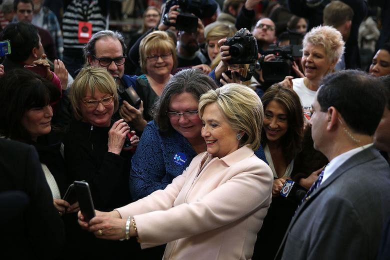 Democratic presidential candidate Hillary Clinton with her supporters in Iowa on Friday, ahead of the state caucuses. Twenty-two e-mail messages which passed through her private computer server when she was secretary of state have been declared "top 