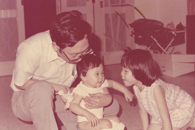 My life so far: Ms Carolyn Kan when she was a baby (above), with her father, Mr Michael Kan, and sister, Geraldine.