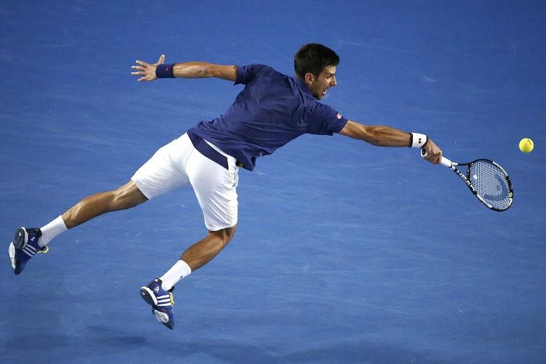 Novak Djokovic stretches for a shot during his 6-1, 7-5, 7-6 (7-3) victory in the Australian Open final against Andy Murray yesterday. The straight-sets victory meant that Murray has lost five times in Australian Open finals.