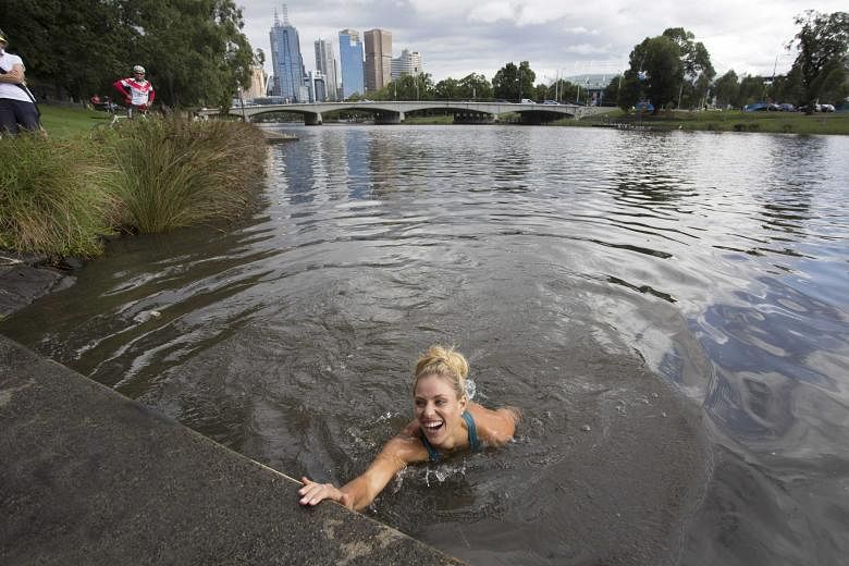 Fresh from her upset win over world No. 1 Serena Williams in the Australian Open women's final, Angelique Kerber honoured a bet by swimming in the Yarra River beside Rod Laver Arena yesterday.
