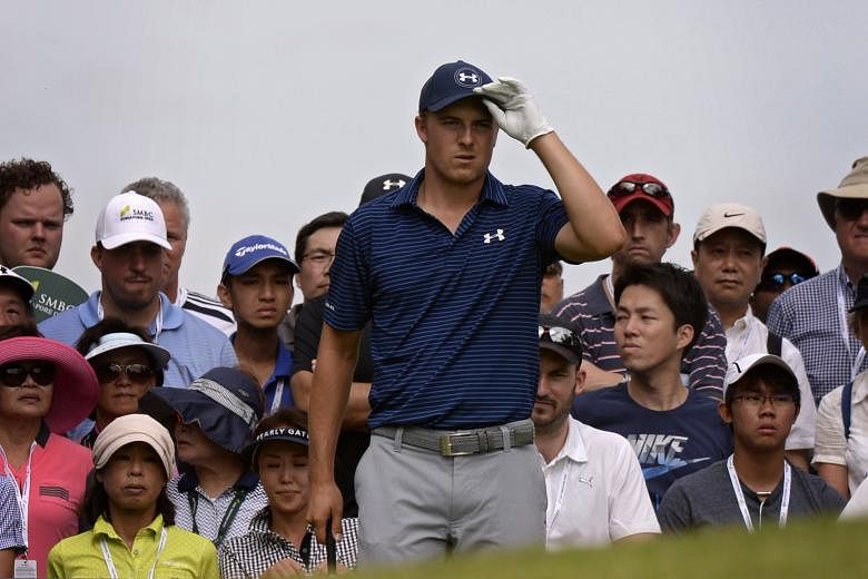 Jordan Spieth of the USA, playing his sixth overseas tournament in nearly four months, preparing to tee off at the third hole yesterday. A reflective Spieth said he was "trying to do too much".