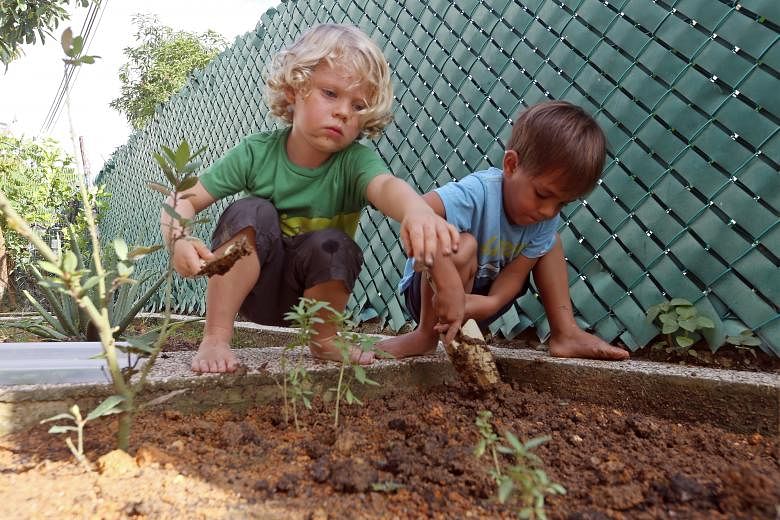 The Garden House Preschool children such as Deklan Arleth (left) and Johan Larson, both three, spend time outdoors each day.