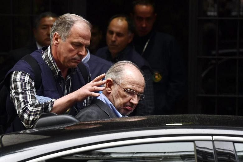 Former International Monetary Fund chief Rodrigo Rato being taken away by the police last year. Rato could face a 41/2-year prison sentence.