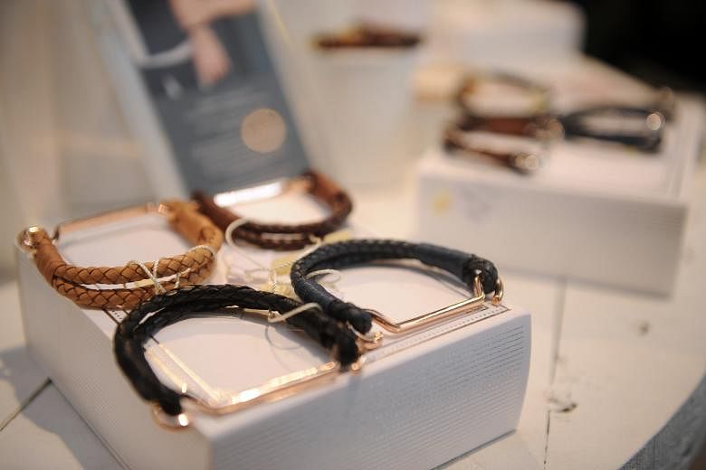 The capsule collection by designer Carolyn Kan (left) to mark the 10th anniversary of Hong Kong lifestyle store Kapok offers accessories such as leather bracelets (above).