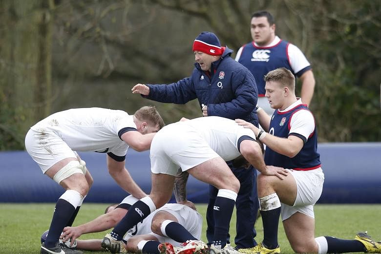 New England head coach Eddie Jones drilling the forwards during training on Thursday. Much is expected of him and new skipper Dylan Hartley as the team bid to redeem themselves after becoming the first World Cup hosts to fail to make the knockout pha
