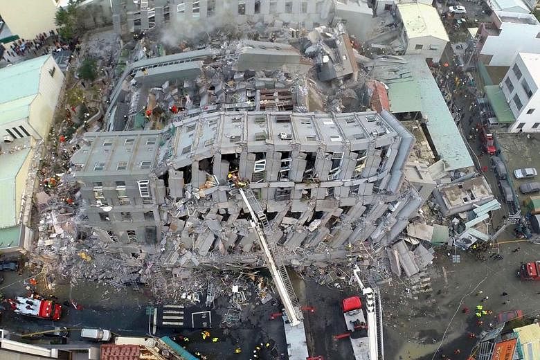 An aerial shot of Wei-guan Golden Dragon Building in Tainan city, where most of the casualties in the quake were found. Cooking oil cans reportedly found in the debris of its pillars have raised questions on its structural safety. A probe will be lau