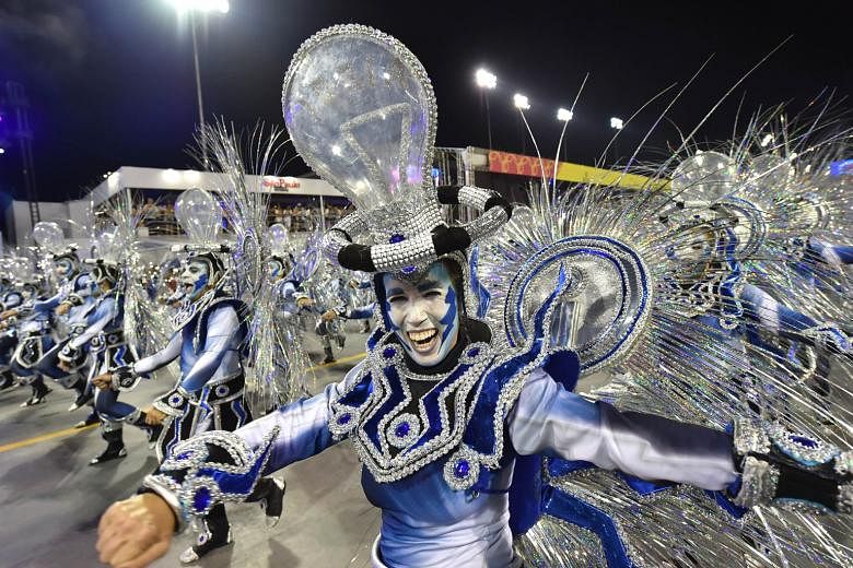 Samba dancers performing at the Sambadrome in Sao Paulo on Saturday. The mega bash is expected to attract one million tourists.