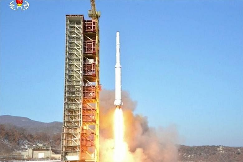 North Korea's Kwangmyongsong-4 satellite being fired from a launch site in North Pyongan province yesterday.