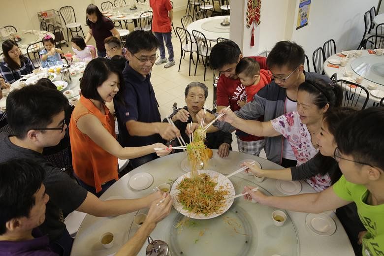 Madam Tiow Seng (centre, seated), 92, enjoying a four-generation reunion lunch with (clockwise from left) her son Michael Chan, 54; grandson Chan Hong Kai, 25; daughter-in-law Regina Chan, 51; son George Chan, 60; grandson Dex Lee, 39, carrying his 1