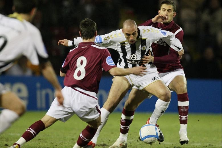 Billy Mehmet on the attack for St Mirren in February 2010 against Hearts' Ian Black (left) and Ismael Bouzid, in their Scottish League Cup semi-final. He scored the only goal but his team lost in the final.