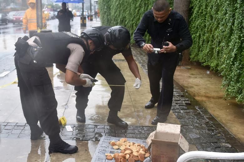 Indonesian bomb squad police examining a suspicious box, which turned out to contain a cake, in Jakarta. Even as the Indonesian authorities focus on strengthening anti-terrorism efforts, many security experts are urging the government not to ignore t
