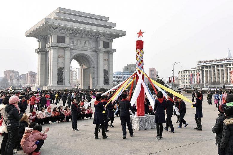 A fairing section retrieved off South Korea's Jeju island following Sunday's rocket launch by the North. North Koreans celebrating Chinese New Year's Day in Pyongyang after the country launched a long-range rocket on Sunday. Widely seen as a disguise