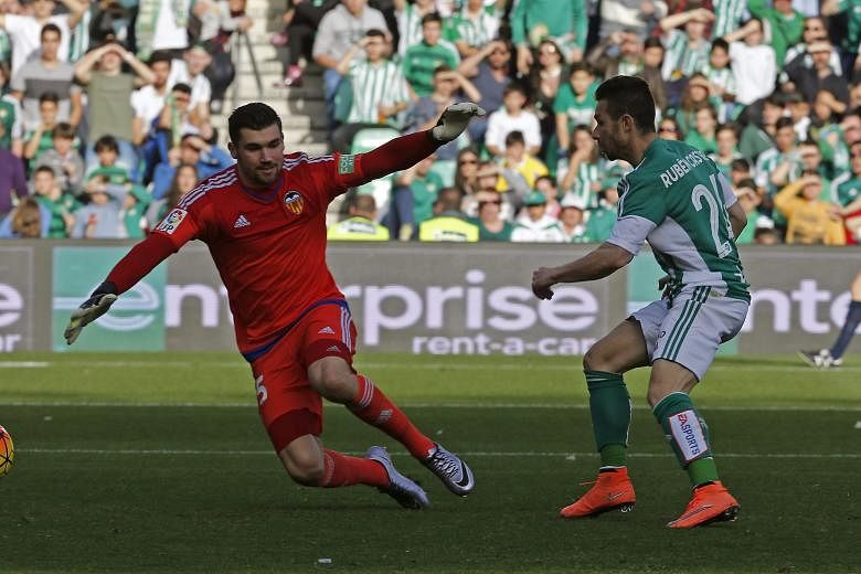 Betis striker Ruben Castro scoring the winner past Valencia goalkeeper Matthew Ryan. While coach Gary Neville has faced the brunt of criticism during their poor run, the whole team have been below par.