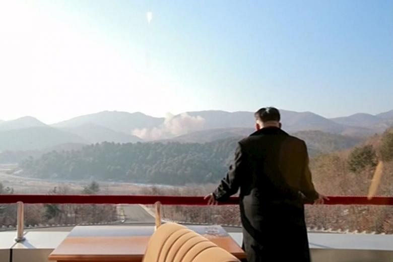 North Korean leader Kim Jong Un watching the launch of a long-range rocket in a Yonhap release on Feb 7. Separately, US national intelligence director James Clapper says the Obama administration now regards North Korea, rather than Iran, as the world