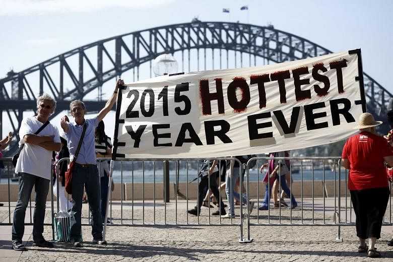 A rally in front of the Sydney Harbour Bridge ahead of the 2015 Paris Climate Change Conference in December. Australia's national science agency has been widely condemned after it revealed plans to make drastic cuts to research into climate change mo